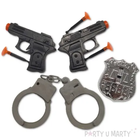 zestaw policjant pistolety odznaka i kajdanki tropic