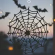 dekoracja na halloween papierowa zawieszka pajeczyna do powieszenia czarna 20 cm